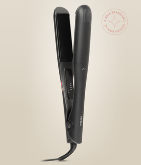 Astral Black Omnia Styler Max upright and open, with its plate and temperature controls visible.