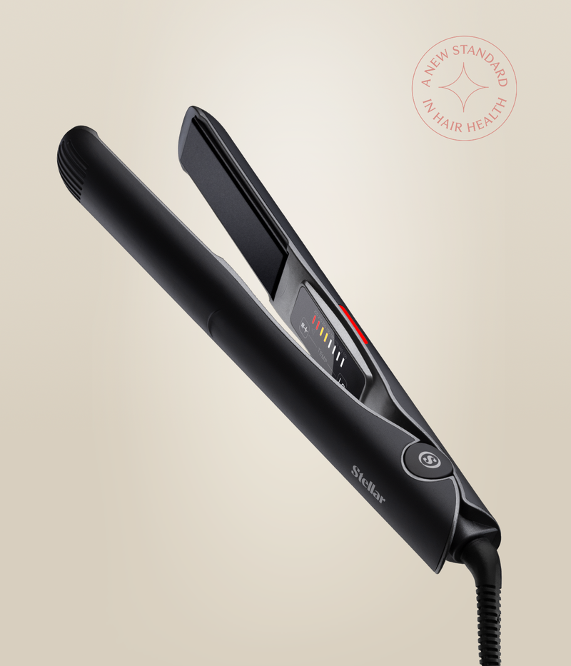 Astral Black Omnia Styler Classic open at an angle, showing the plates, temperature controls and cord.