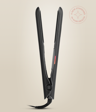 Side view of the Astral Black Omnia Styler Classic standing open, showing its hinge and cord.