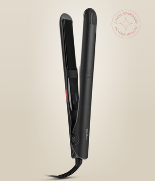 Astral Black Omnia Styler Classic upright and open, with its plate and temperature controls visible.