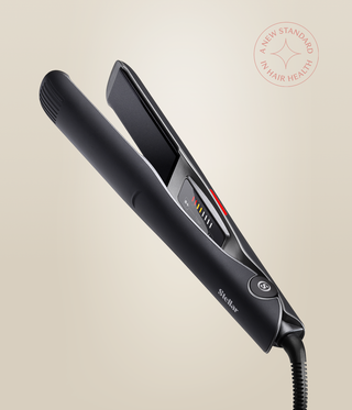 Astral Black Omnia Styler Plus open at an angle, showing the plates, temperature controls and cord.