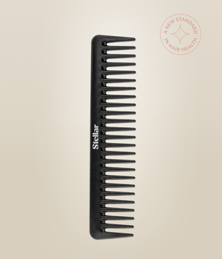 Black Carbon Dressing Comb shown upright, with widely spaced teeth and a white Stellar logo.
