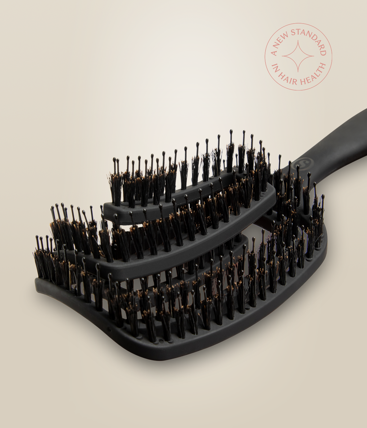 Close-up of boar bristles and hand-dipped pins on the OmniFlex Vent Brush.